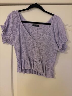 Smocked V-Neck Peplum Blouse in Light Lavender